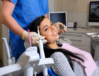 Picture of a young woman sitting in a dental chair