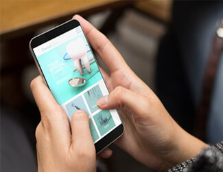 Picture of somebody holding a cellphone and typing