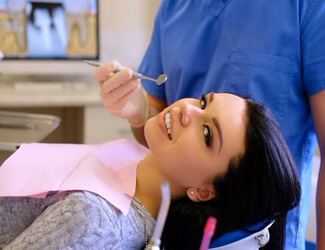 Picture of a young lady sitting on a dental chair